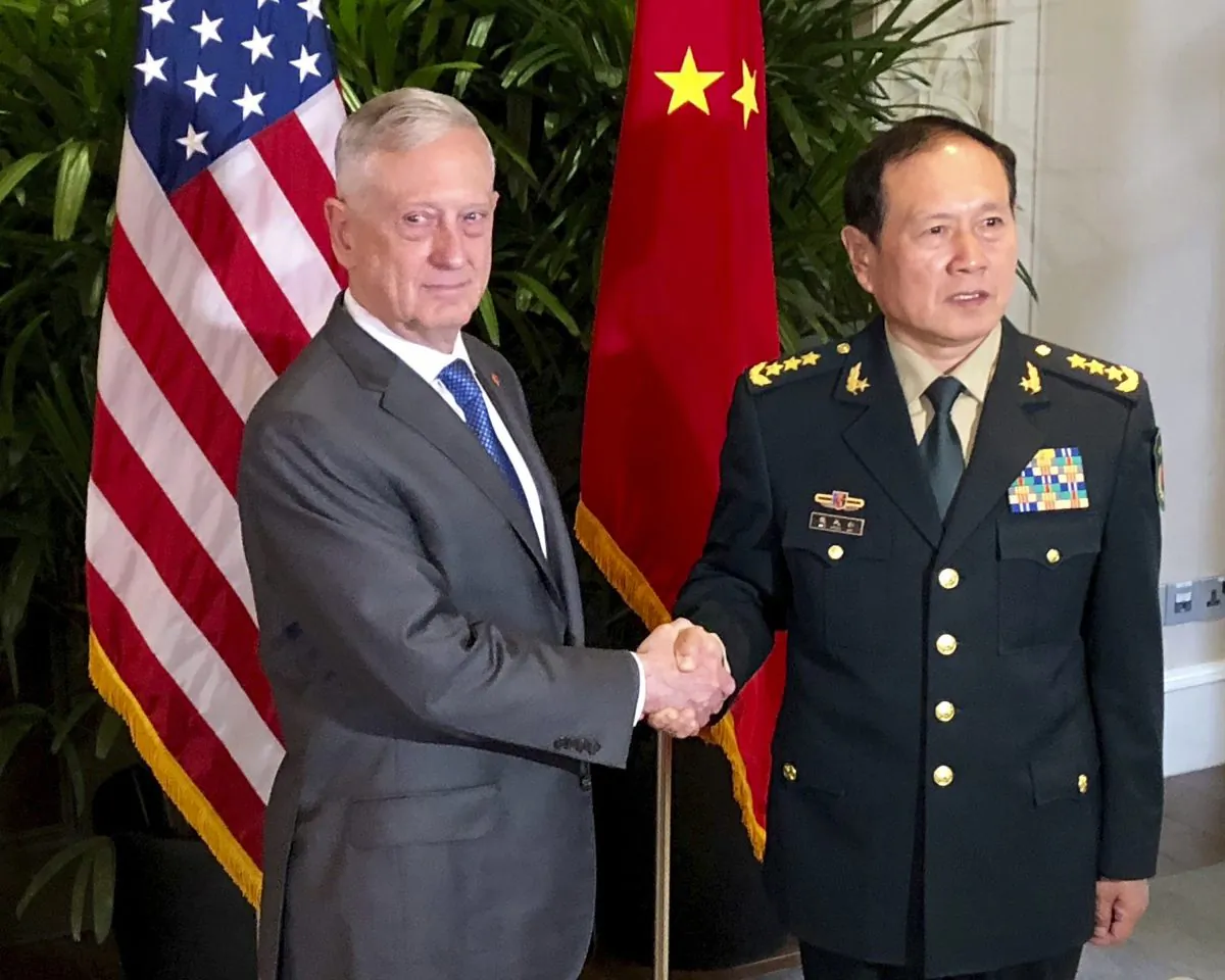 U.S. Defense Secretary Jim Mattis, left, meets Chinese Defense Minister Wei Fenghe in Singapore on Oct. 18, 2018. Mattis and Secretary of State Mike Pompeo will meet Friday, Nov. 9 with their counterparts Fenghe and Yang Jiechi at the State Department. (Robert Burns/AP)
