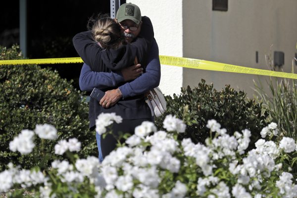 mourners embrace at Thousand Oaks
