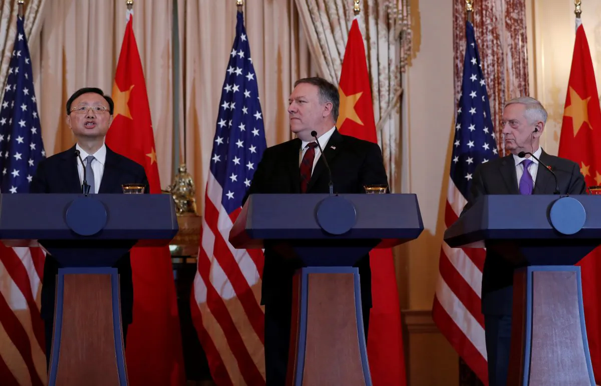 U.S. Secretary of State Mike Pompeo and then-Defense Secretary James Mattis listen to Chinese Communist Party Office of Foreign Affairs Director Yang Jiechi speak as they hold a joint media news conference after participating in a second diplomatic and security meeting at the U.S. Department of State, Washington, D.C. on Nov. 9, 2018. (Leah Millis/Reuters)