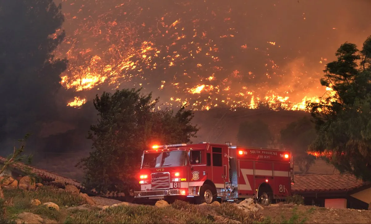 Firefighters from various departments work to protect structures as the Woolsey Fire moves through the property on Cornell Road near Paramount Ranch in Agoura Hills, Calif., on Nov. 9, 2018. (Matthew Simmons/Getty Images)