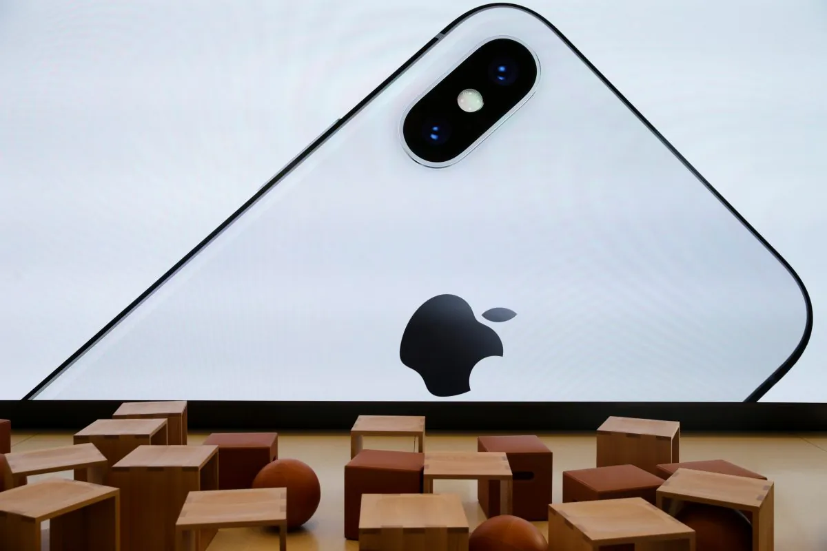 An iPhone X is seen on a large video screen in the new Apple Visitor Center in Cupertino, California, on Nov. 17, 2017. (Elijah Nouvelage/Reuters)