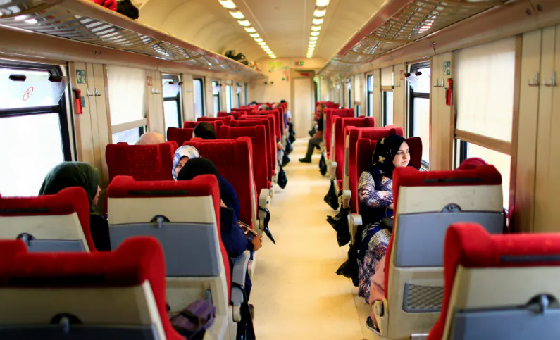 Passengers sit aboard the train on the way to Fallujah after leaving Baghdad Railway Station, the newly resurrected service to the city, in Baghdad, Iraq on Nov. 7, 2018. (Thaier al-Sudani/Reuters)