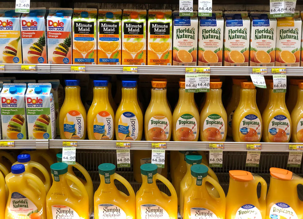 Containers of orange juice are displayed on a shelf at a grocery store on Oct. 29, 2018 in San Rafael, California. With a seasonal shortage of oranges and grapefruit, U.S. based orange juice makers, including Tropicana and Minute Maid, have downsized their bottles from 59 ounces to 52 ounces without lowering the price of the product. (Justin Sullivan/Getty Images)