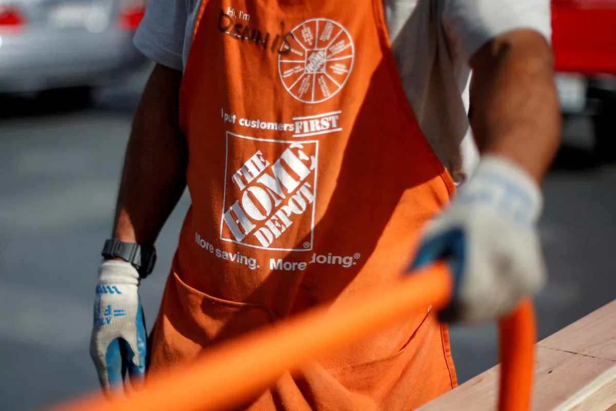 A Home Depot employee is seen outside a store in Los Angeles, Calif., on March 17, 2015. (Lucy Nicholson/Reuters)