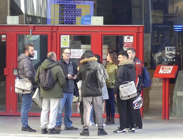 A group of workers stand in front of the office of the General Workers’ Union in Barcelona.