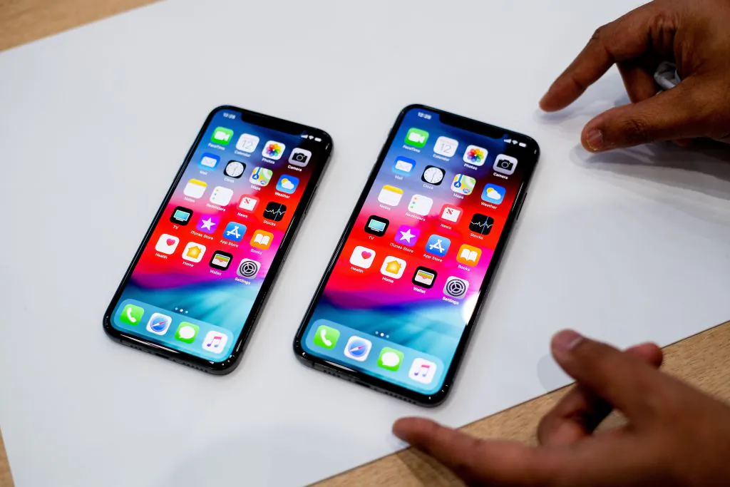 An Apple iPhone Xs Max (R) and iPhone Xs rest on a table during a launch event in Cupertino, California, on Sept.12, 2018. (Noah Berger/AFP/Getty Images)