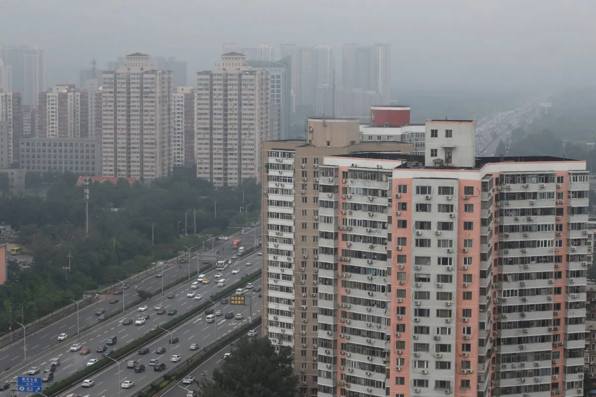 Residential buildings are seen along the Fourth Ring Road in Beijing, on July 16, 2018. (Jason Lee/Reuters)