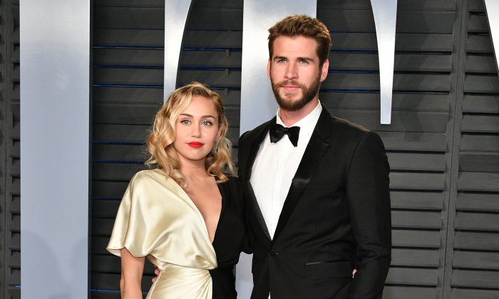 Miley Cyrus (L) and Liam Hemsworth attend the 2018 Vanity Fair Oscar Party at Wallis Annenberg Center for the Performing Arts in Beverly Hills, Calif., on March 4, 2018. (Dia Dipasupil/Getty Images)