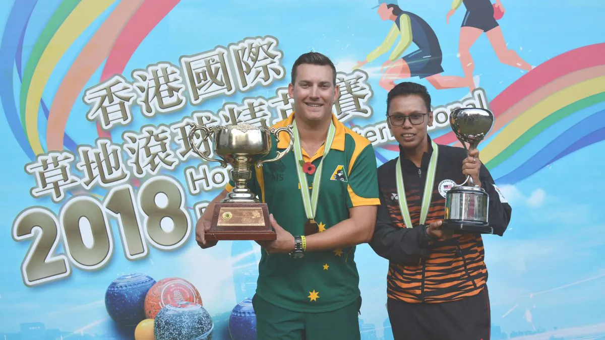 Australian Benjamin Twist (left) and Malaysia Siti Zalina Ahmad happily holding their Hong Kong International Bowls Classic singles trophies after winning their respective finals on Sunday, Nov 11, 2018 at Craigengower Cricket Club. (Stephanie Worth)