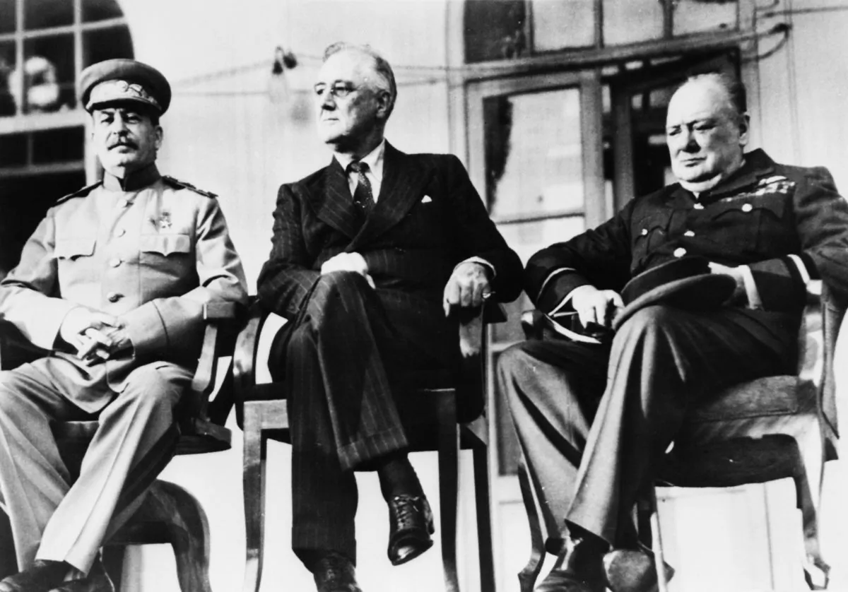 The historic meeting of the "Big Three" in Tehran, Iran, in December 1943. (L–R) Soviet dictator Josef Stalin (1879–1953), U.S. President Franklin Delano Roosevelt (1882–1945), and British Prime Minister Winston Churchill (1874–1965). The three leaders met in person for the first time to discuss the co-ordination of Allied war efforts and the post-war aims of their respective countries. (Keystone/Hulton Archive/Getty Images)