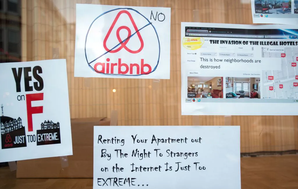 Signs showing support for Proposition F are posted on a shop window in San Francisco, Calif. in this file photo. Proposition F, known to some as the Airbnb initiative, restricts short term rentals in the city (JOSH EDELSON/AFP/Getty Images)
