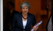 May Secures Draft Divorce Deal With EU, Faces Hostile UK Lawmakers