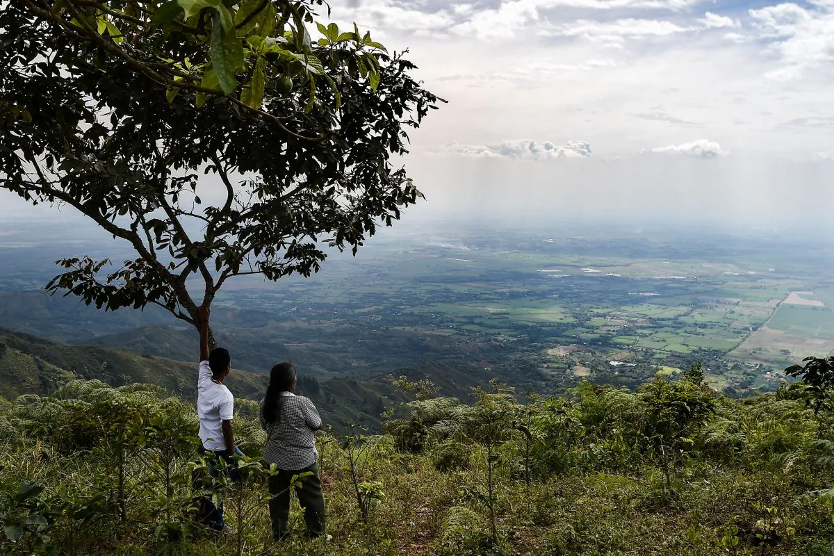 Relatives and friends of Luis Dagua, a community leader killed and whose body was found on the side of a road with apparent signs of violence, attend his funeral in rural area of Caloto, Cauca Department, Colombia, on July 18, 2018. (Luis Robayo Luis/ AFP/Getty Images)  