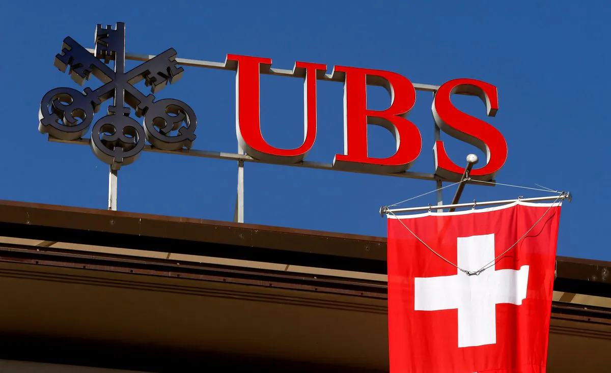 Switzerland's national flag flies under the logo of Swiss bank UBS in Zurich, Switzerland April 24, 2017. (Arnd Wiegmann/File Photo/Reuters)