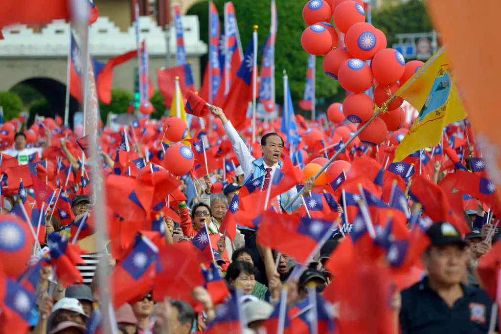 Attendees of a political campaign rally wave Taiwan flags, in Taipei on Nov. 11, 2018. (Chris Stowers/AFP/Getty Images)
