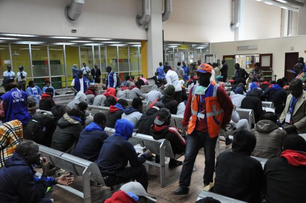 Returnees from Libya wait at the Yaounde Nsimalen International Airport.