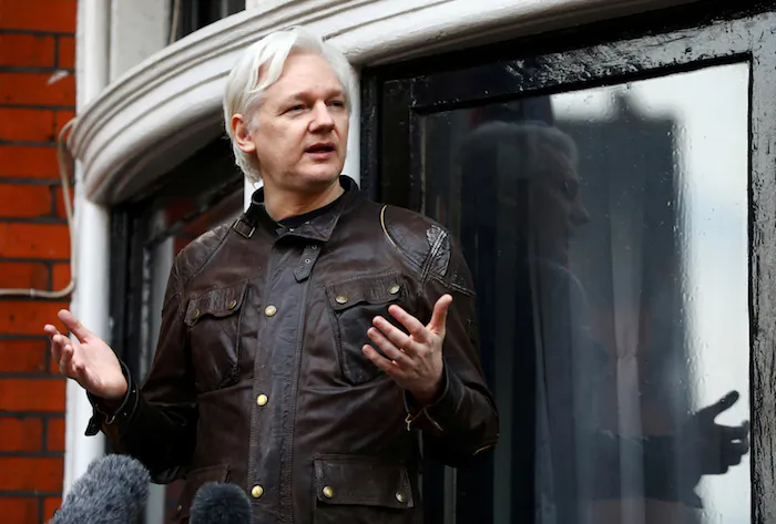 WikiLeaks founder Julian Assange is seen on the balcony of the Ecuadorian Embassy in London on May 19, 2017. (Reuters/Neil Hall)
