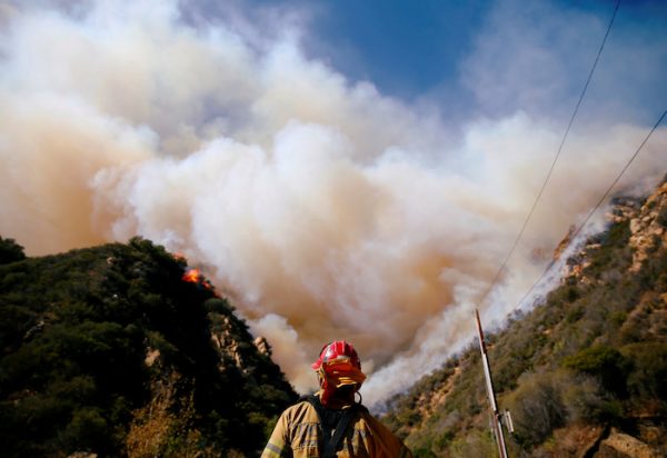 Firefighters battle the Woolsey Fire as it continues to burn in Malibu