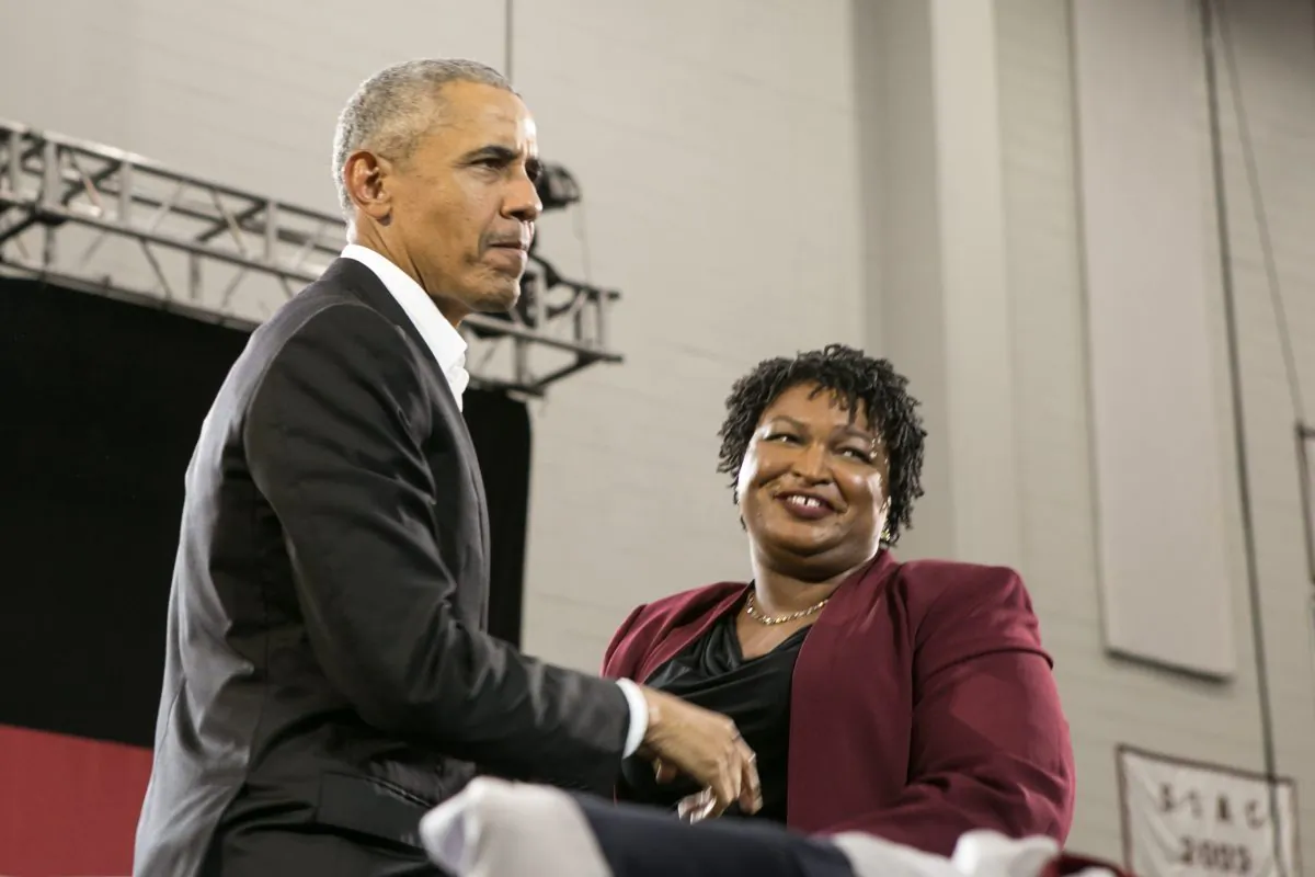 Former President Barack Obama stands with Georgia Democratic Gubernatorial candidate Stacey Abrams during a campaign rally at Morehouse College in Atlanta, Georgia on Nov. 2, 2018. Obama spoke in Atlanta to endorse Abrams and encourage Georgians to vote. (Jessica McGowan/Getty Images)