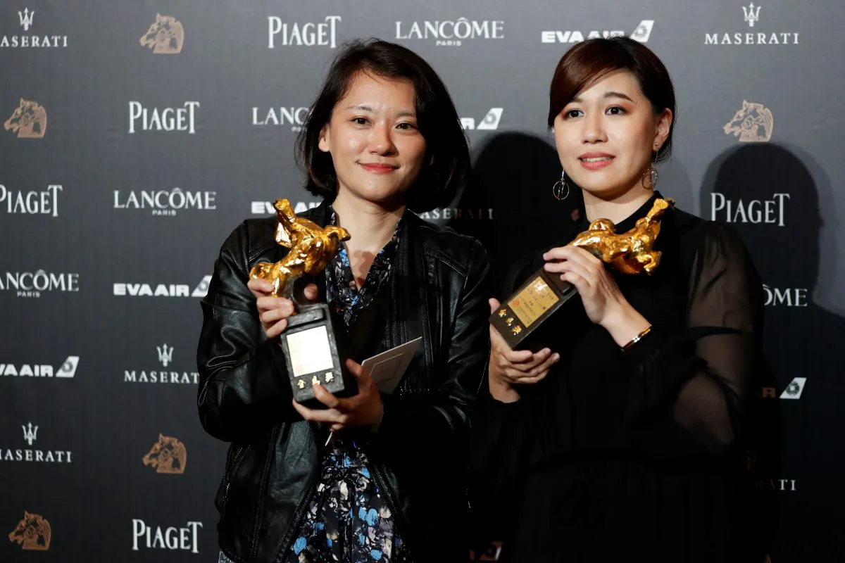 Taiwanese director Yue Fu (R) poses backstage after winning Best Documentary for her movie "Our Youth in Taiwan" at the 55th Golden Horse Awards in Taipei, Taiwan on November 17, 2018. (REUTERS/Tyrone Siu)