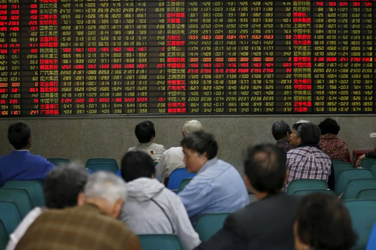 Investors look at an electronic board showing stock information at a brokerage house in Shanghai, China, on April 21, 2016. (Aly Song/Reuters)