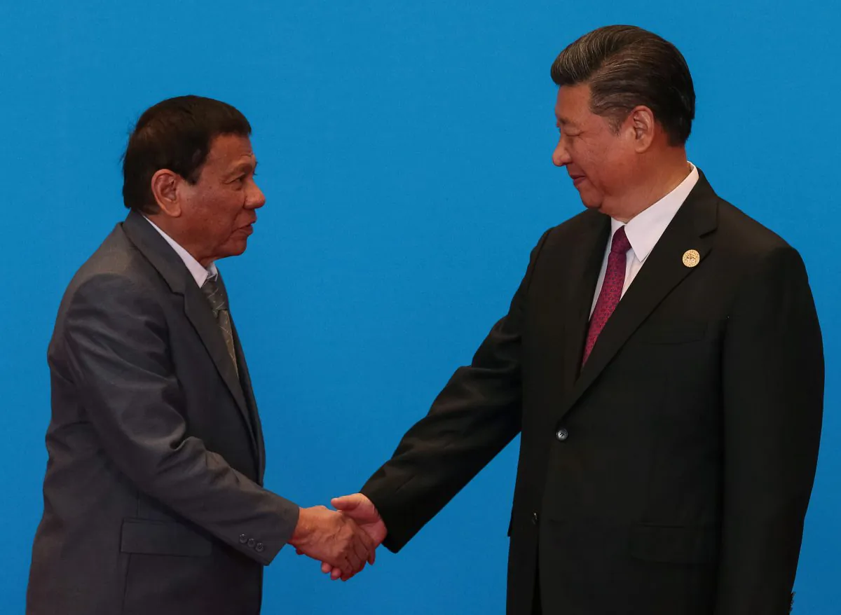 Chinese leader Xi Jinping shakes hands with Philippine President Rodrigo Duterte as they attend the welcome ceremony at Yanqi Lake during the Belt and Road Forum in Beijing on May 15, 2017. (Roman Pilipey/Reuters)