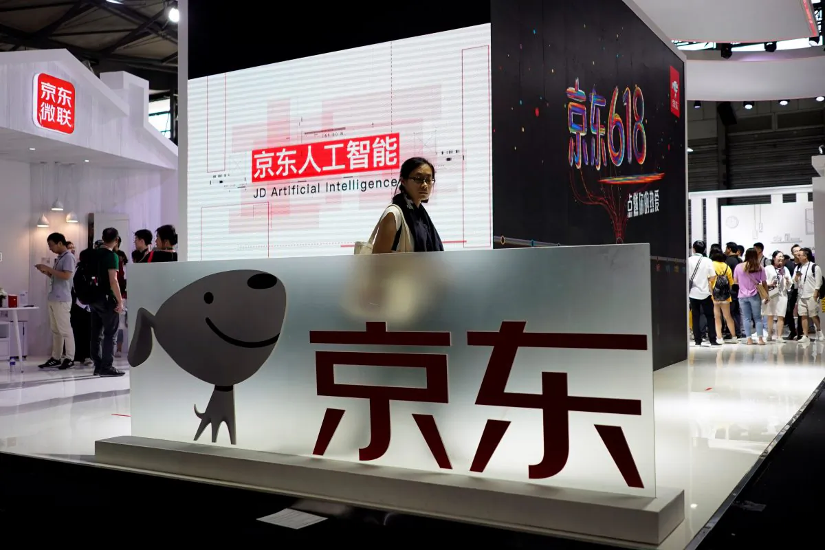 A sign of Chinese e-commerce company JD.com at CES (Consumer Electronics Show) Asia 2018 in Shanghai, China, on June 14, 2018. (Aly Song/Reuters)