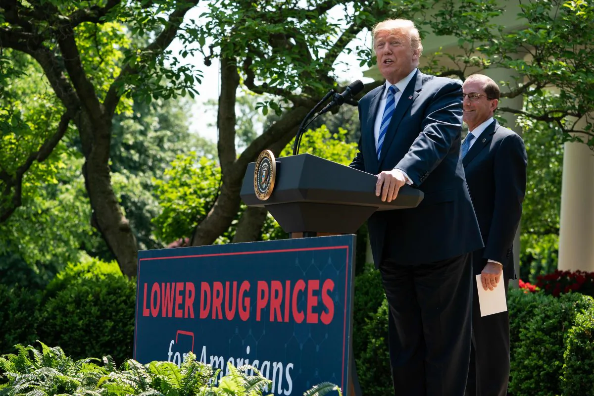 U.S. President Donald Trump delivers remarks with Health and Human Services Secretary Alex Azar (R) on reducing drug costs in the Rose Garden at the White House in Washington, DC, on May 11, 2018. (NICHOLAS KAMM/AFP/Getty Images)