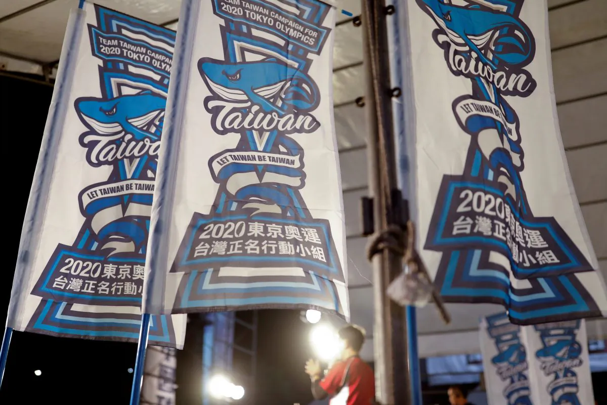 Flags in support of the referendum on whether the island should participate in the 2020 Tokyo Olympics under the name "Taiwan" rather than "Chinese Taipei" are seen during a rally in Taipei on July 29, 2018. (Tyrone Siu/Reuters)