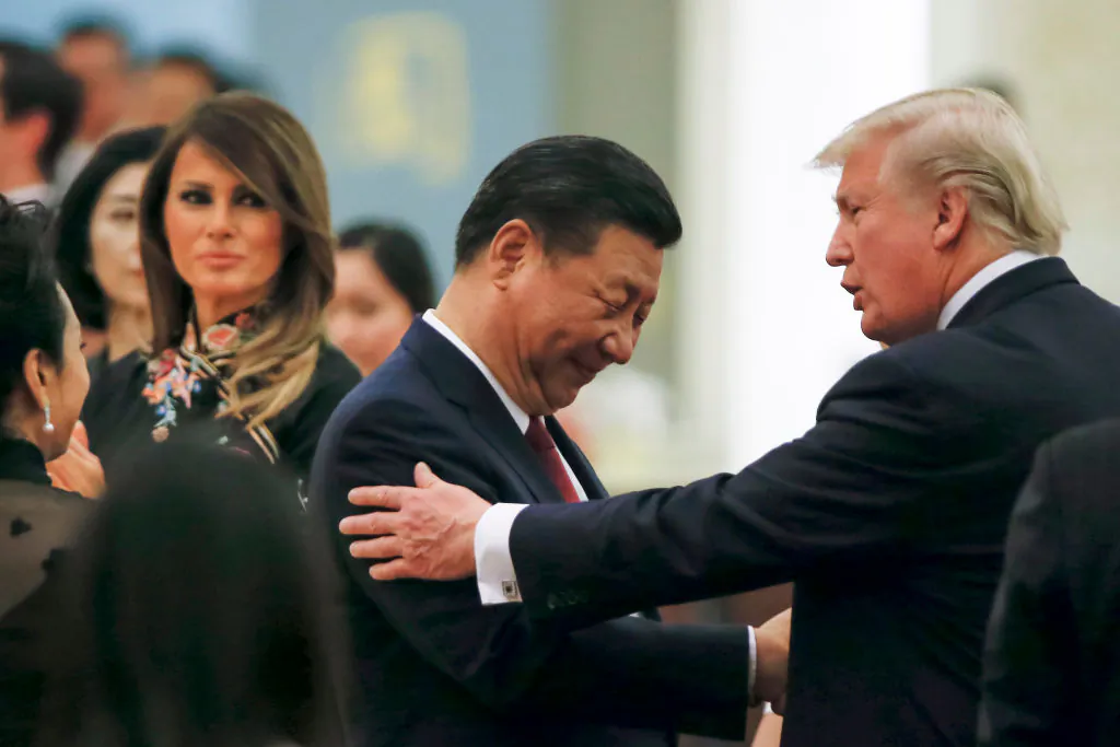 President Donald Trump (R) talks to China's leader Xi Jinping during a state dinner at the Great Hall of the People in Beijing on Nov. 9, 2017. 
(THOMAS PETER/AFP/Getty Images)