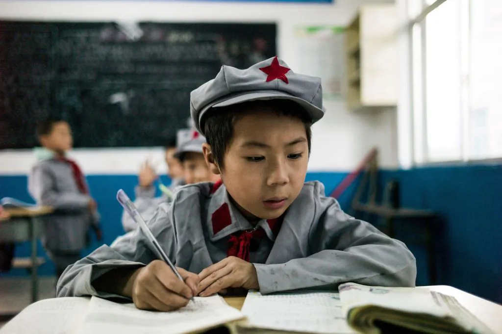 Students study in their classroom at the Yang Dezhi elementary school in Wenshui, Xishui country in southwestern China's Guizhou province, on Nov. 7, 2016. (Fred Dufour/AFP/Getty Images)