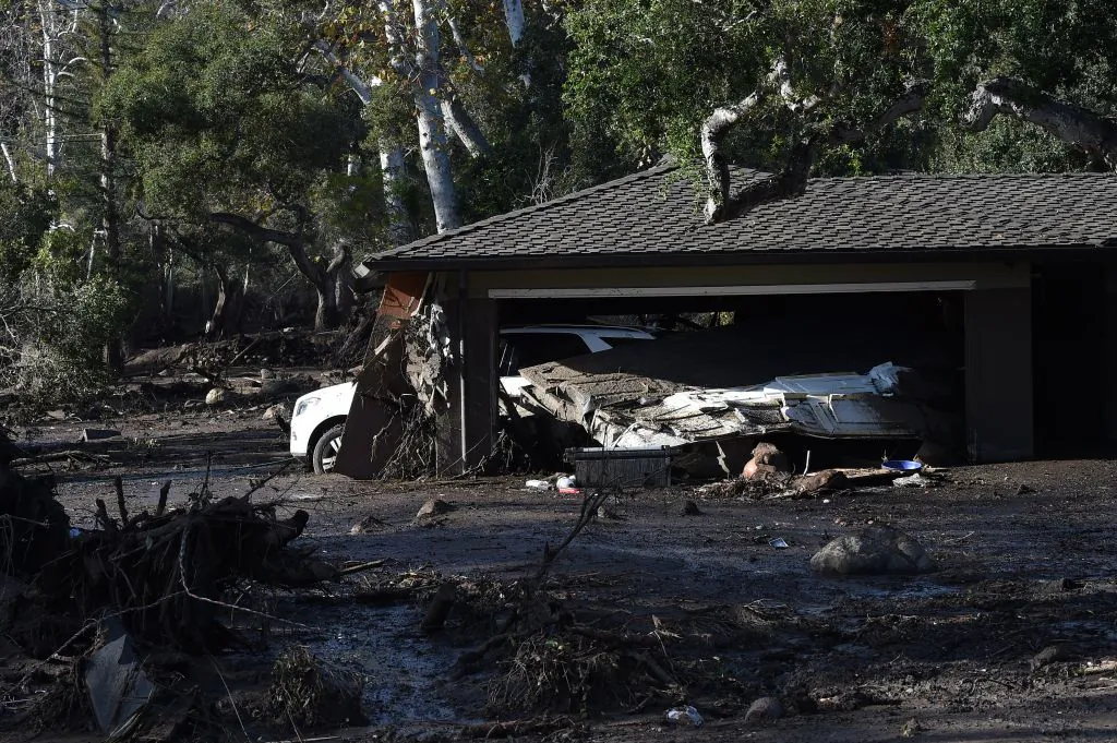 A home is surrounded by mud and debris caused by a massive mudflow in Montecito, Calif., on Jan. 10, 2018. (Robyn Beck/AFP/Getty Images)