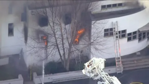 Officials: Family Found Dead in NJ Mansion Fire Were Stabbed, Shot Before