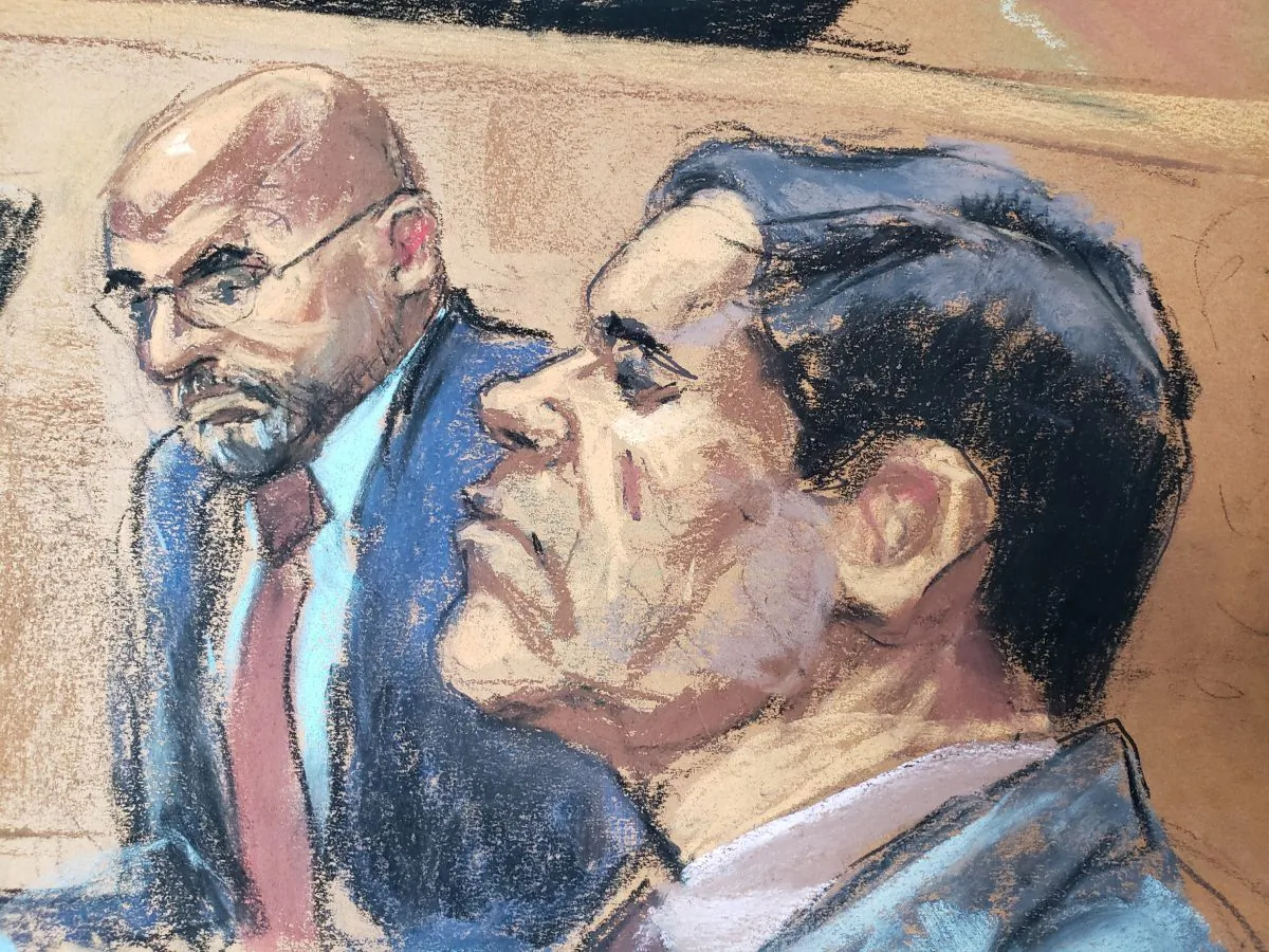 The accused Mexican drug lord Joaquin "El Chapo" Guzman (R), appears with defense attorney A. Eduardo Balarezo (L) in this courtroom sketch as he appears in Brooklyn federal court in New York on Nov. 19, 2018. (Jane Rosenberg/Reuters)