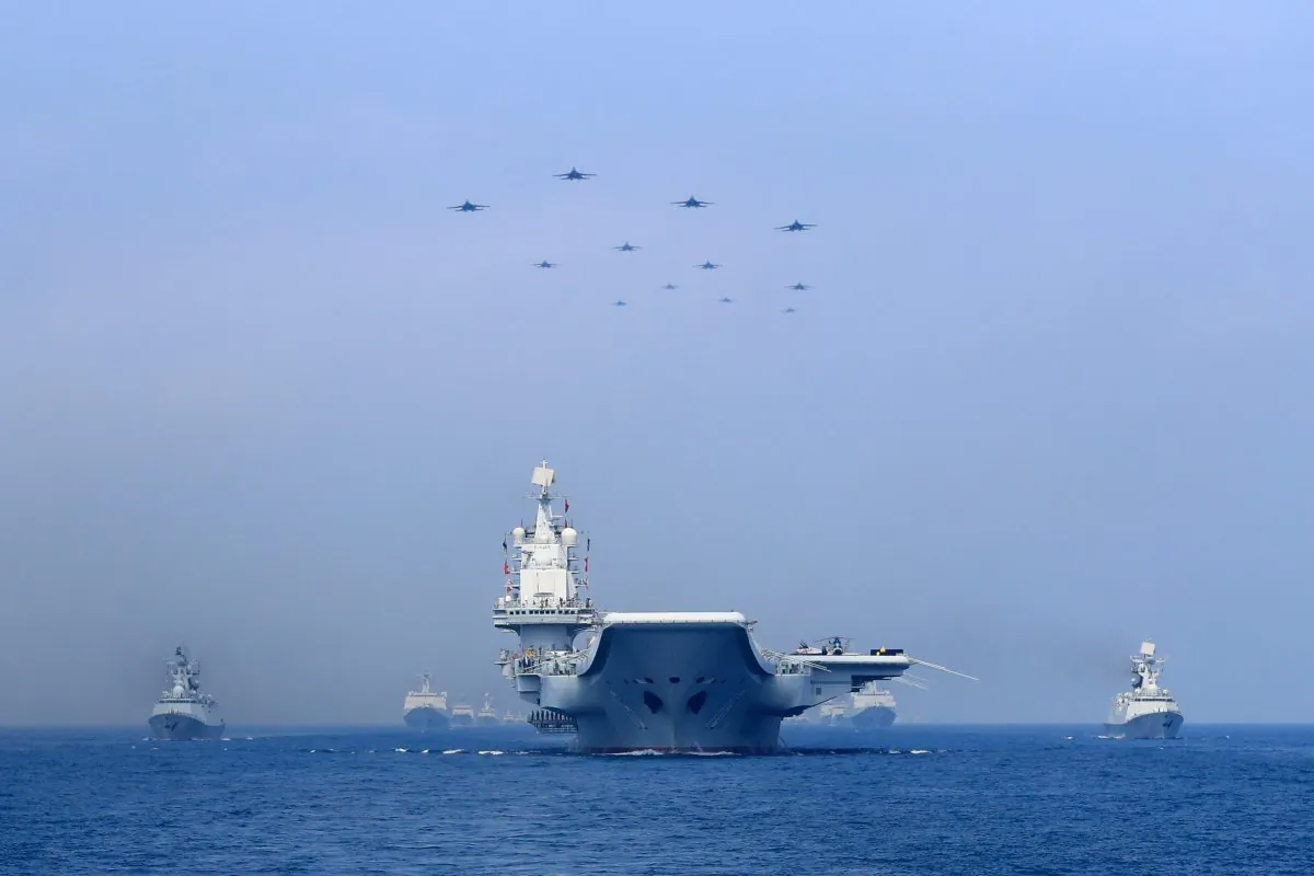 Warships and fighter jets of Chinese People's Liberation Army (PLA) Navy take part in a military display in the South China Sea on April 12, 2018. (Reuters)