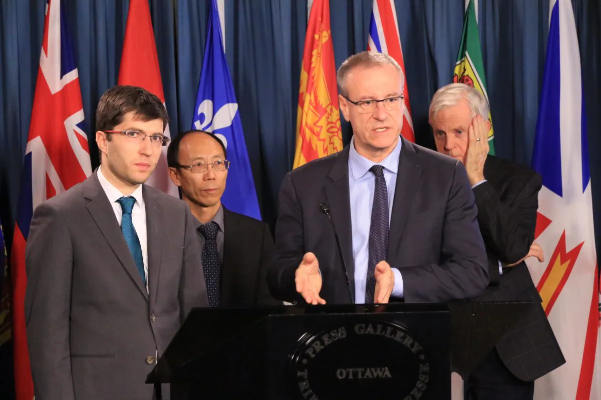 Liberal MP Borys Wrzesnewskyj (2nd-R) speaks at a press conference ahead of a House of Commons debate on organ trafficking bill S-240, introduced by Conservative MP Garnett Genuis (L), with He Lizhi (2nd-L), a Falun Dafa adherent persecuted in China, and former cabinet minister David Kilgour (R), on Parliament Hill, Ottawa, on Nov. 20, 2018. (Jonathan Ren/The Epoch Times)