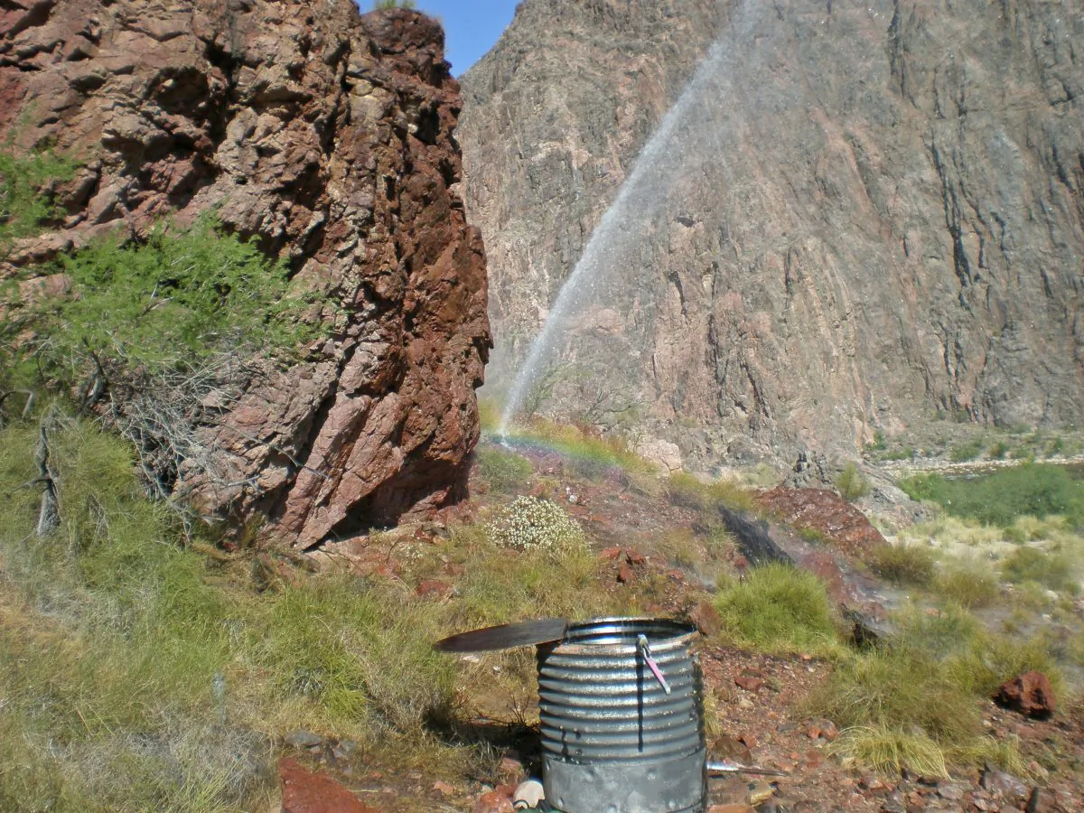 Rainbow visible from water spraying from a break in the Trans-canyon Waterline along the North Kaibab Trail. (NPS)