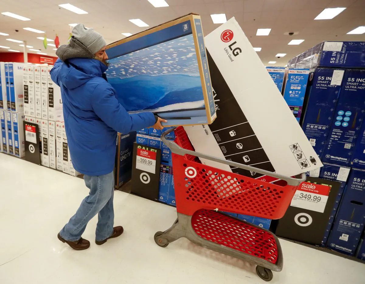 A customer loads his shopping cart during the Black Friday sales event on Thanksgiving Day at Target in Chicago, Illinois, on Nov. 24, 2016. (Kamil Krzaczynski - S1AEUOTVCAAA/File Photo/Reuters)