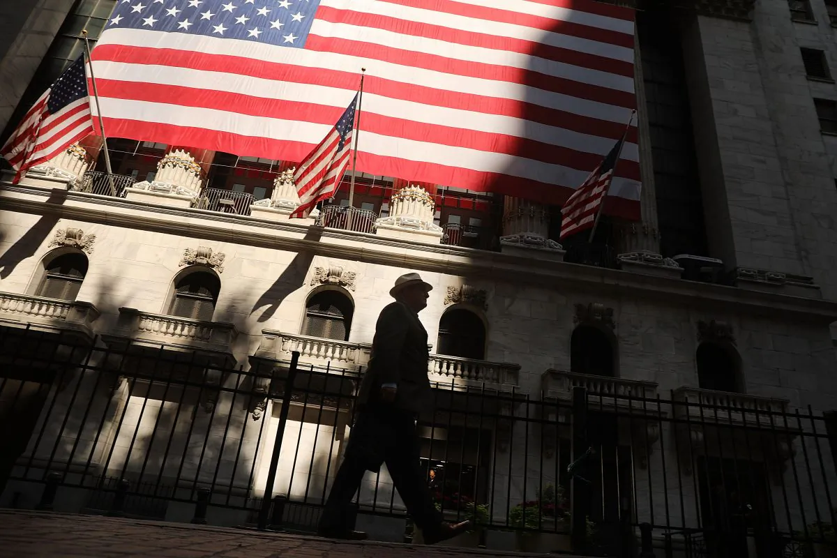 A man walks by the New York Stock Exchange (NYSE) in New York, in this file photo. The economy has done well for everybody after Donald Trump's election but faces headwins with a gridlocked Congress. (Spencer Platt/Getty Images)
