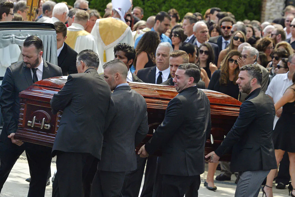 In this Aug. 6, 2016 file photo, mourners carry the casket of Karina Vetrano from St. Helen's Church following her funeral in the Howard Beach section of the Queens borough of New York. (Steven Sunshine/Newsday via AP, File)