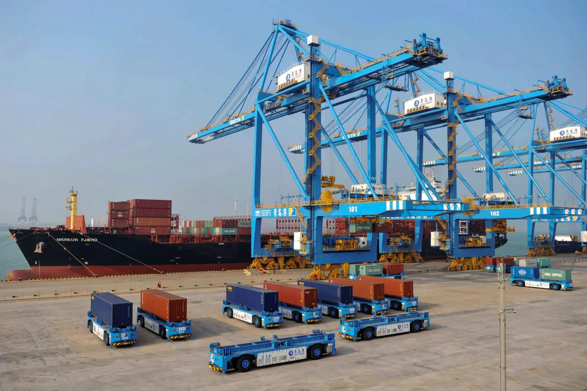 This photo taken on Oct. 24, 2018, shows driverless trucks transferring containers at an automated cargo wharf in Qingdao in China's eastern Shandong province. (STR/AFP/Getty Images)