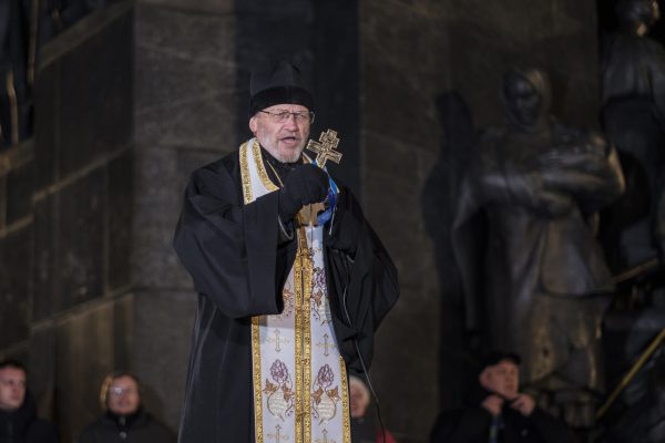 Viktor Marynchak, a Ukrainian Orthodox priest, addresses people gathered in Kharkiv, Ukraine.