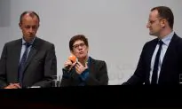 Merkel’s Would-Be Successor Questions Germany’s Constitutional Asylum Pledge