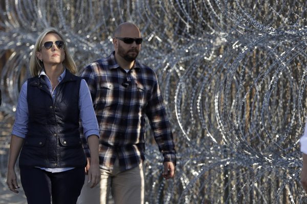 Kirstjen Nielsen inspects a section of border fence