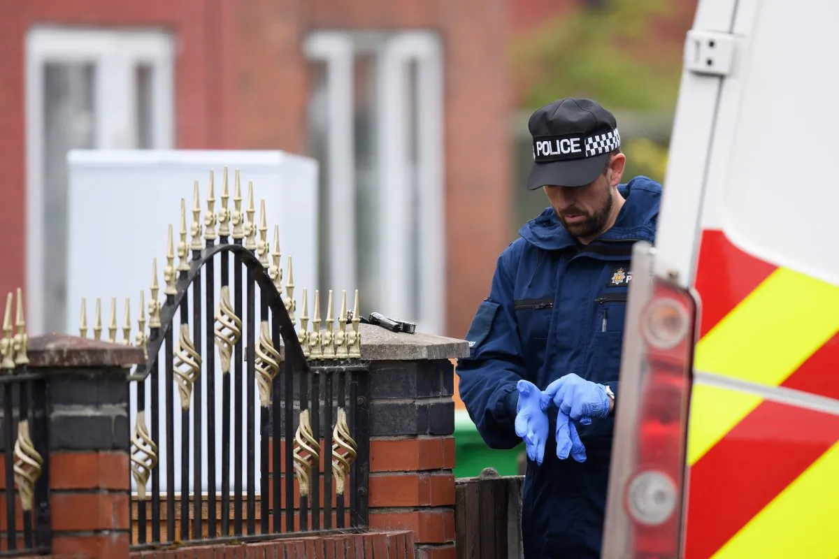 A policeman outside the former home of terrorist Salman Abedi on May 24, 2017 in Manchester, England. (Leon Neal/Getty Images)