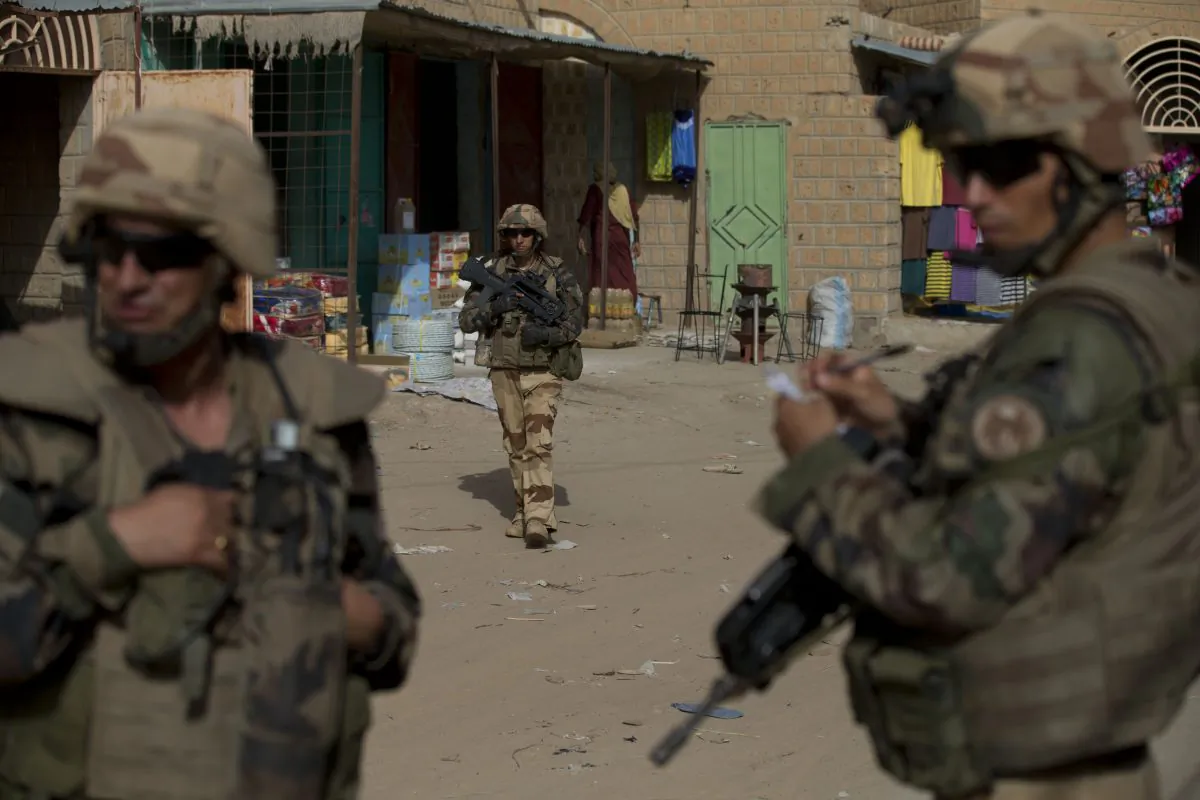 French soldiers patrol through the central market in Timbuktu, Mali. (AP Photo/Rebecca Blackwell, File)