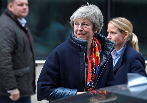 Britain's Prime Minister Theresa May leaves the BBC, after taking part in a live radio phone-in, in central London