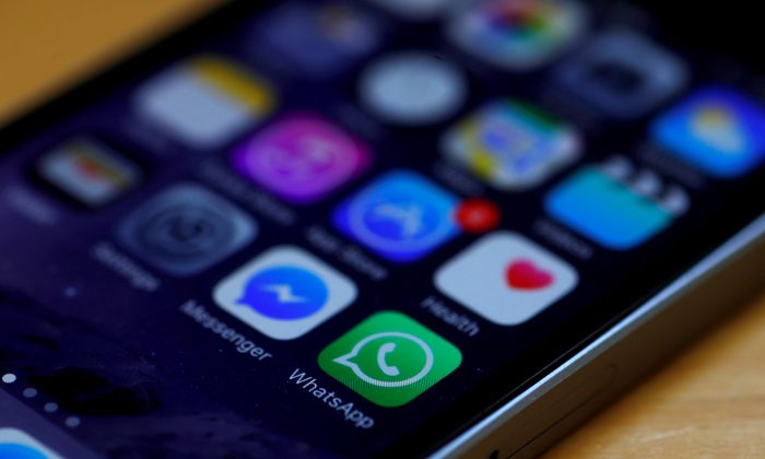 WhatsApp and Facebook messenger icons are seen on an iPhone in Manchester, Britain, on March 27, 2017.  (Phil Noble/Reuters)