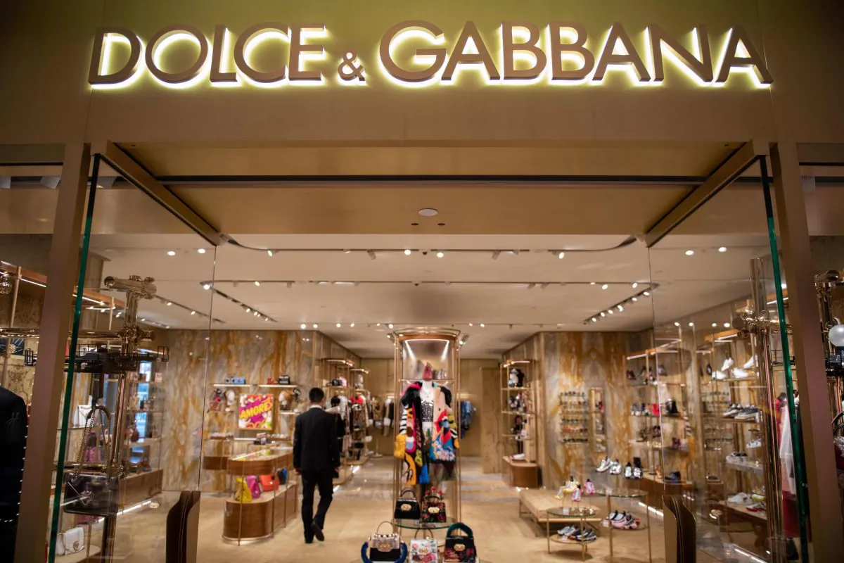 A man walks inside a Dolce & Gabbana shop in Beijing on November 22, 2018. Dolce & Gabbana cancelled a long-planned fashion show in Shanghai on November 21 after an outcry over racially offensive posts on its social media accounts. (NICOLAS ASFOURI/AFP/Getty Images)