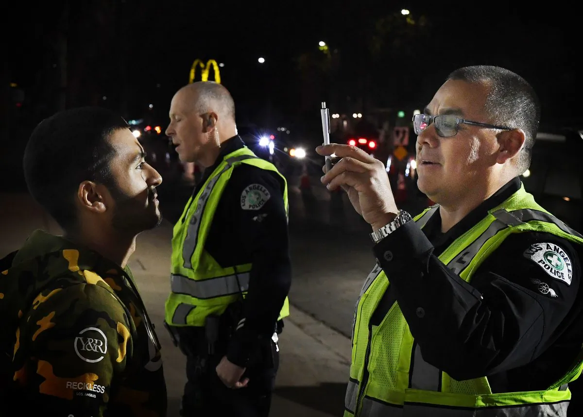 A man undergoes a field sobriety test before being detained at a Los Angeles Police Department DUI checkpoint in Reseda, Calif., on April 13, 2018. (Mark Ralston/AFP/Getty Images)